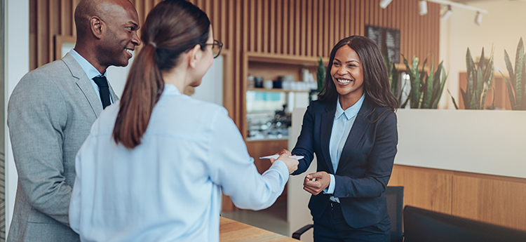 Bank staff greeting customers