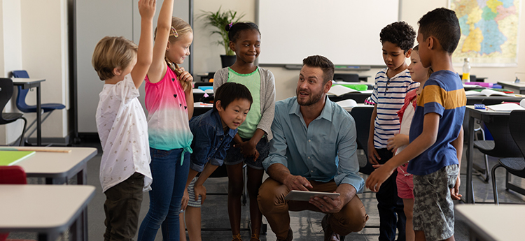 A teacher with students in a classroom